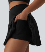 Breezeful™ Jupe-short tennis mini 2-en-1 plissée séchage rapide taille haute croisée avec poches