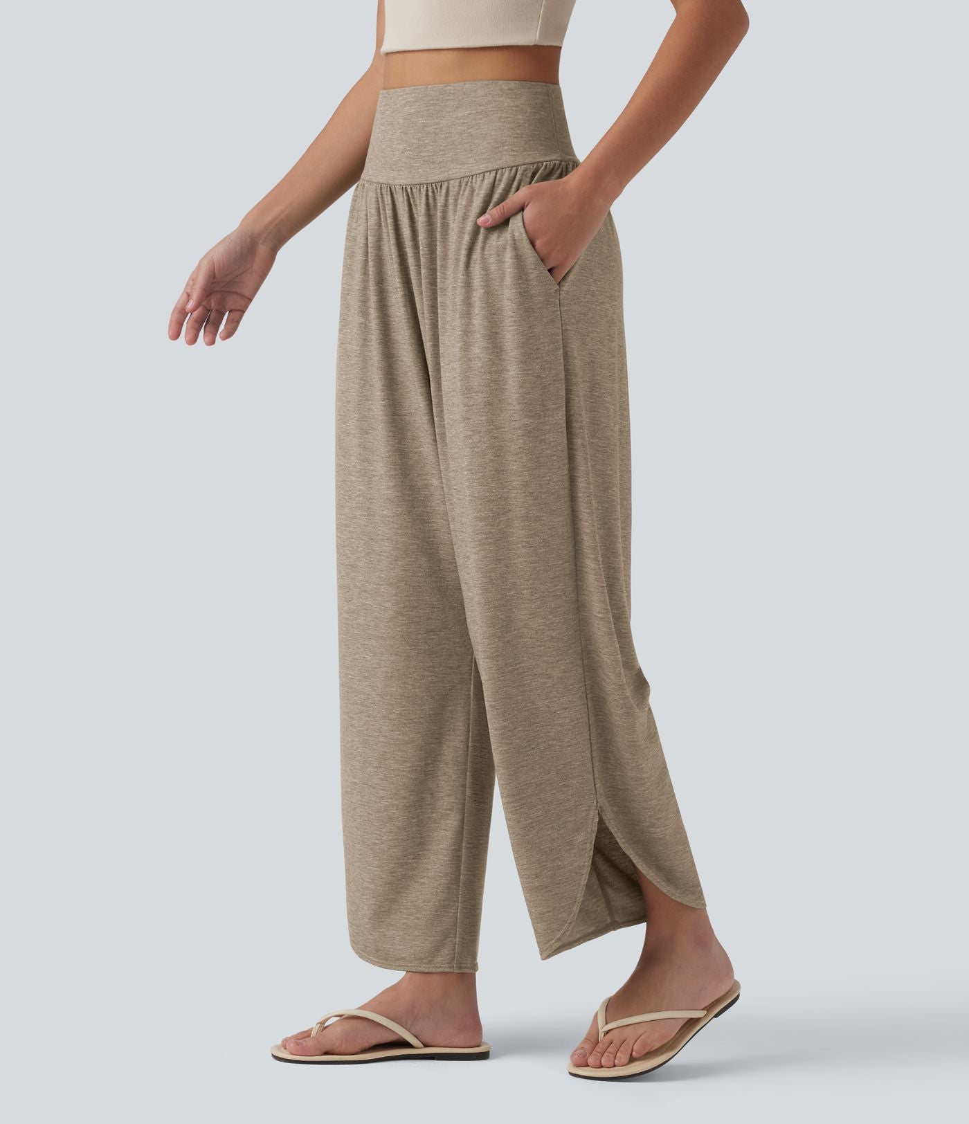 Pantalon décontracté taille haute gainant avec ourlet arrondi et poches