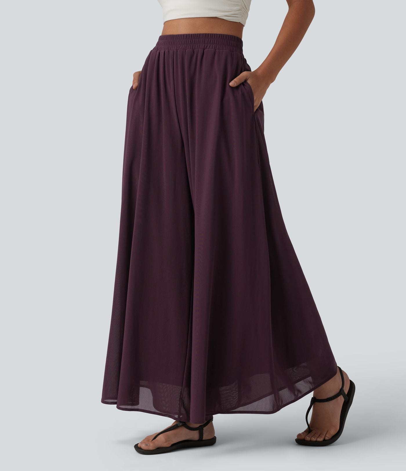 Pantalon fluide et ample avec superposition en mesh, poches latérales et taille haute