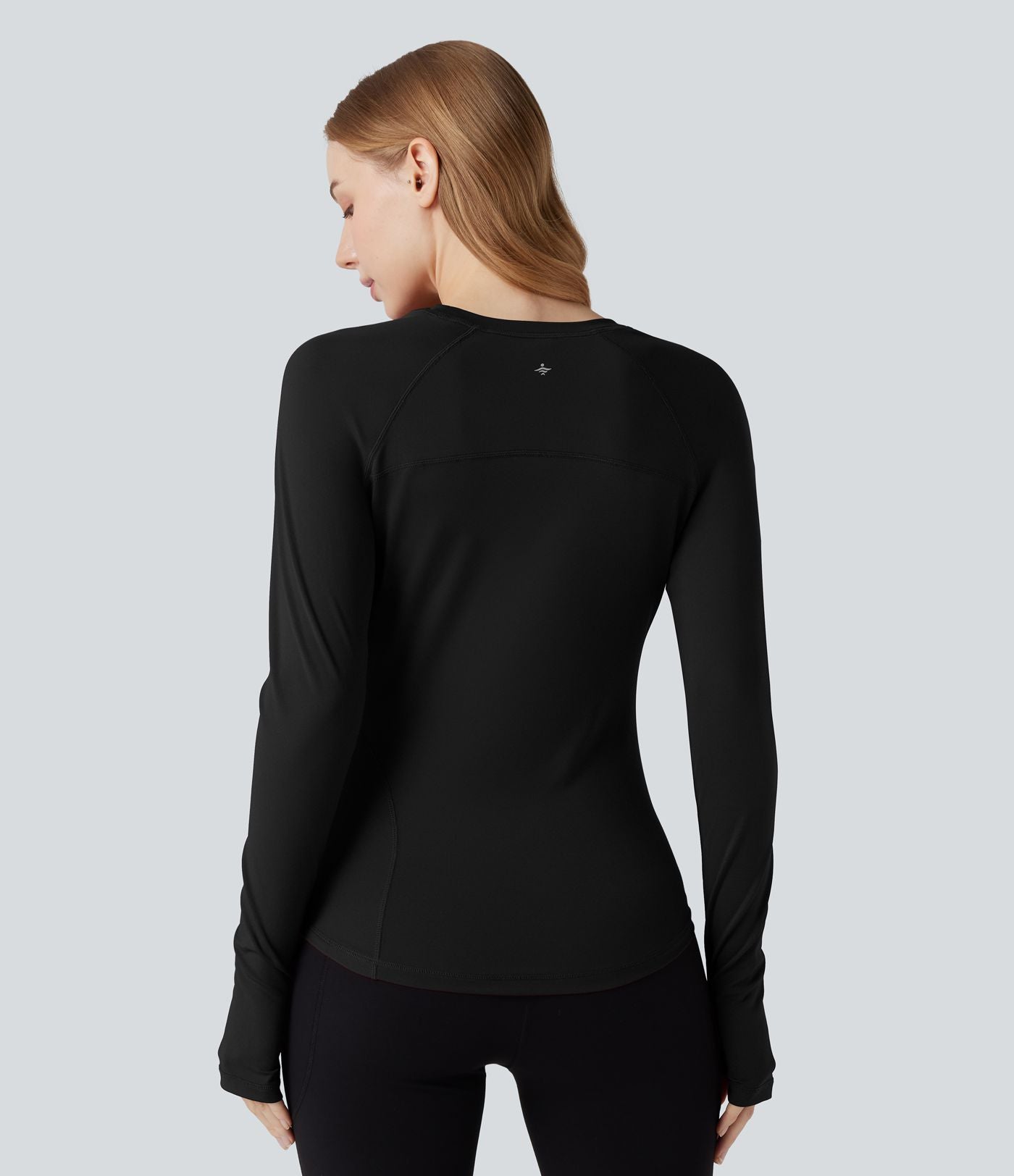 Top de sport col rond ourlet arrondi manches longues avec trous pouces et poche