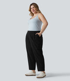 Pantalon grande taille en popeline stretch taille haute, plissé avec ourlet roulotté, longueur 7/8, coupe fuselée, avec poches