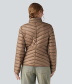 Veste casual compactable en duvet synthétique zippée à col montant et manches longues avec poches