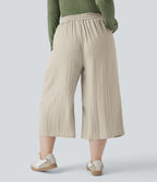 Pantalon grande taille large fluide taille haute avec cordon de serrage, poches et aspect lin