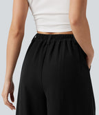 Pantalon tailleur large, taille haute, à poches