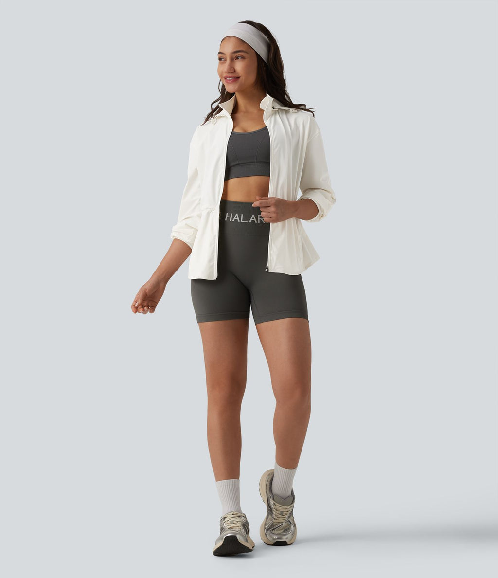 Veste de sport déperlante à capuche amovible avec cordon de serrage et poches zippées