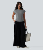 Blouse tailleur asymétrique col drapé manches courtes avec fronces et ourlet fendu