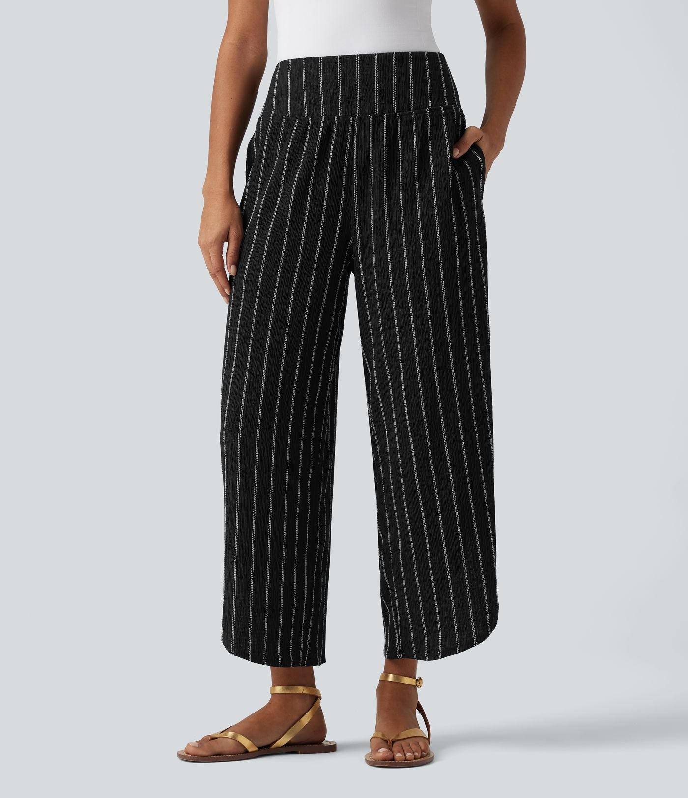 Pantalon rayé taille haute avec ourlet arrondi et poches