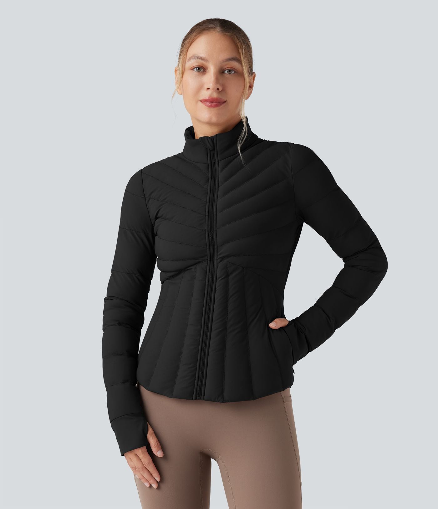 Doudoune de sport extensible col montant avec passants pouces et poches