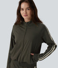 Veste de sport DayStretch col montant color block à rayures avec poches
