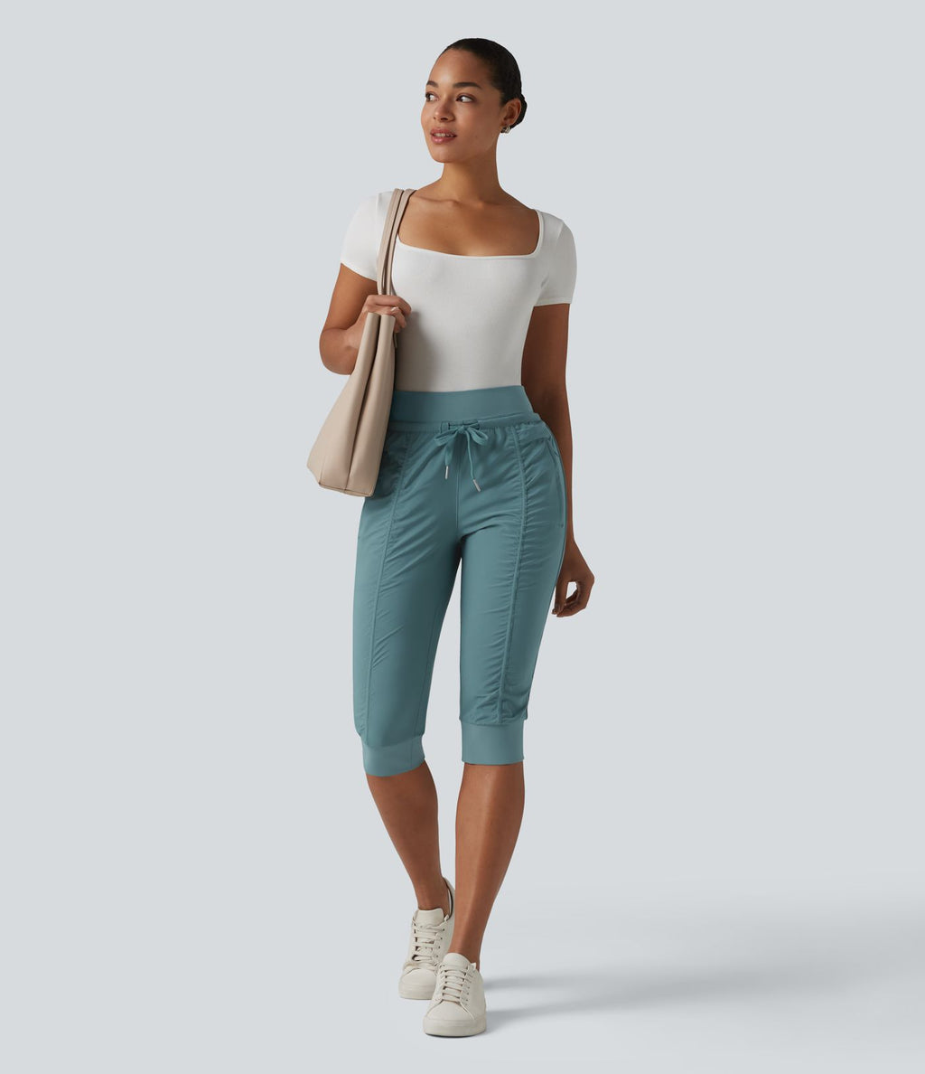 Jogging fuselé taille haute avec cordon de serrage et poches zippées