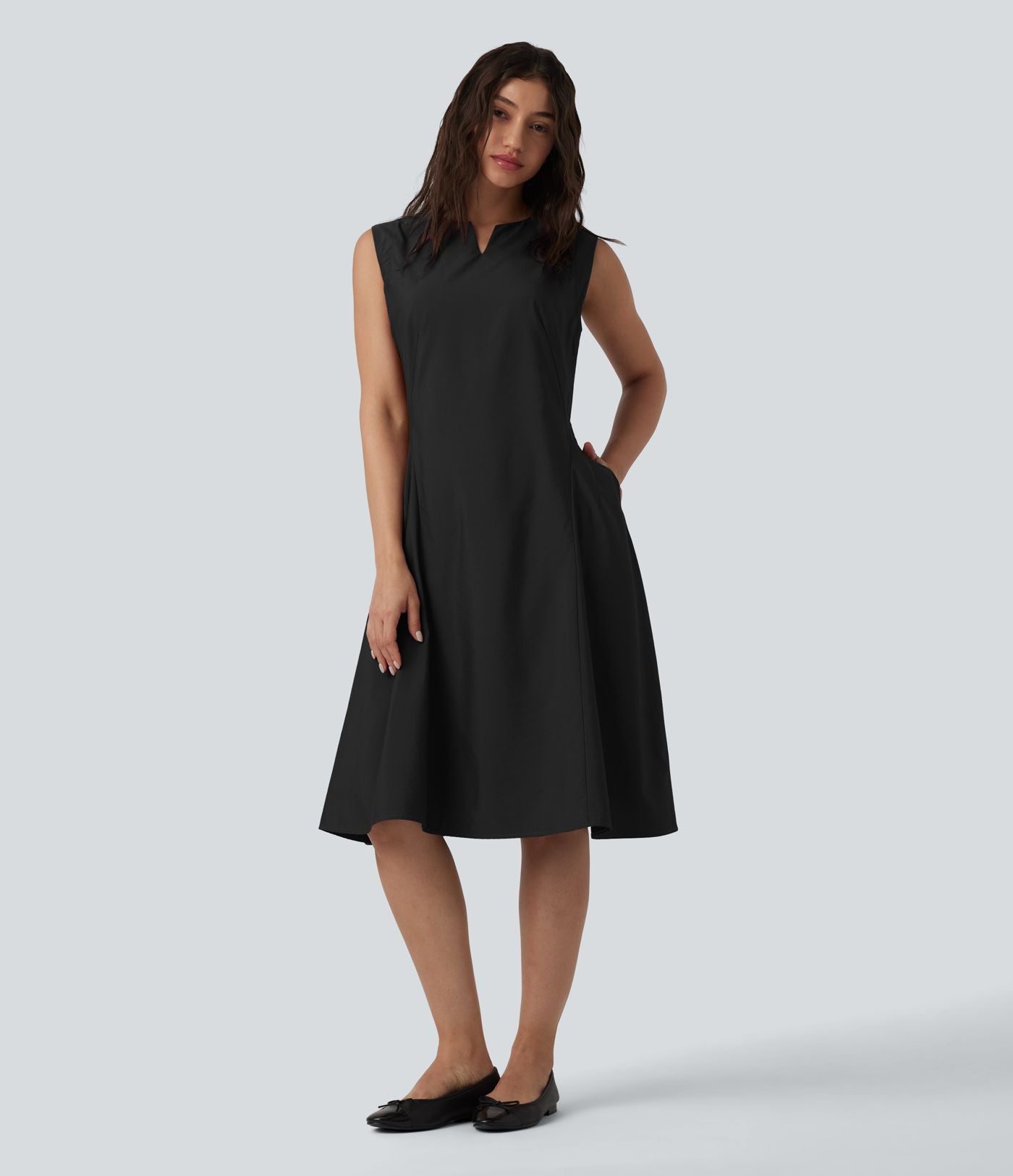 Robe mi-longue évasée de travail col cranté sans manches avec poches