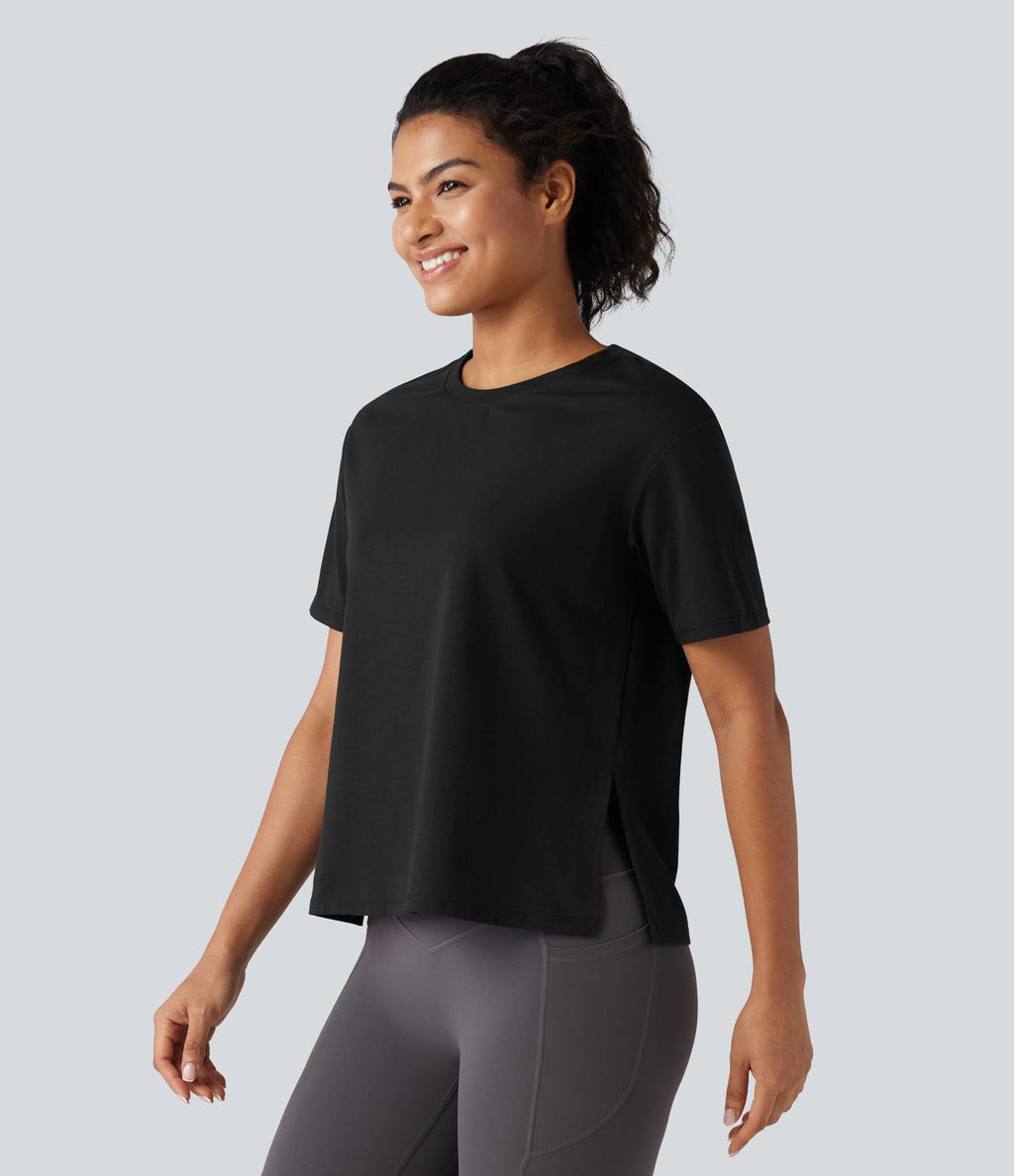 Haut de sport en coton col rond à manches courtes, ourlet fendu et coupe ample pour le yoga