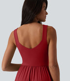 Robe midi fluide sans manches dos croisé, avec brassière intégrée (Bonnets E-G) et poches
