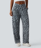 Pantalon tailleur fuselé asymétrique taille mi-haute gaufré imprimé léopard avec poches