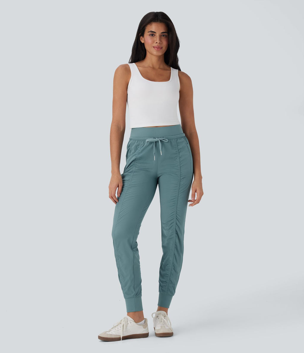 Pantalon jogging de voyage taille haute avec cordon de serrage, coupe fuselée et poches latérales zippées