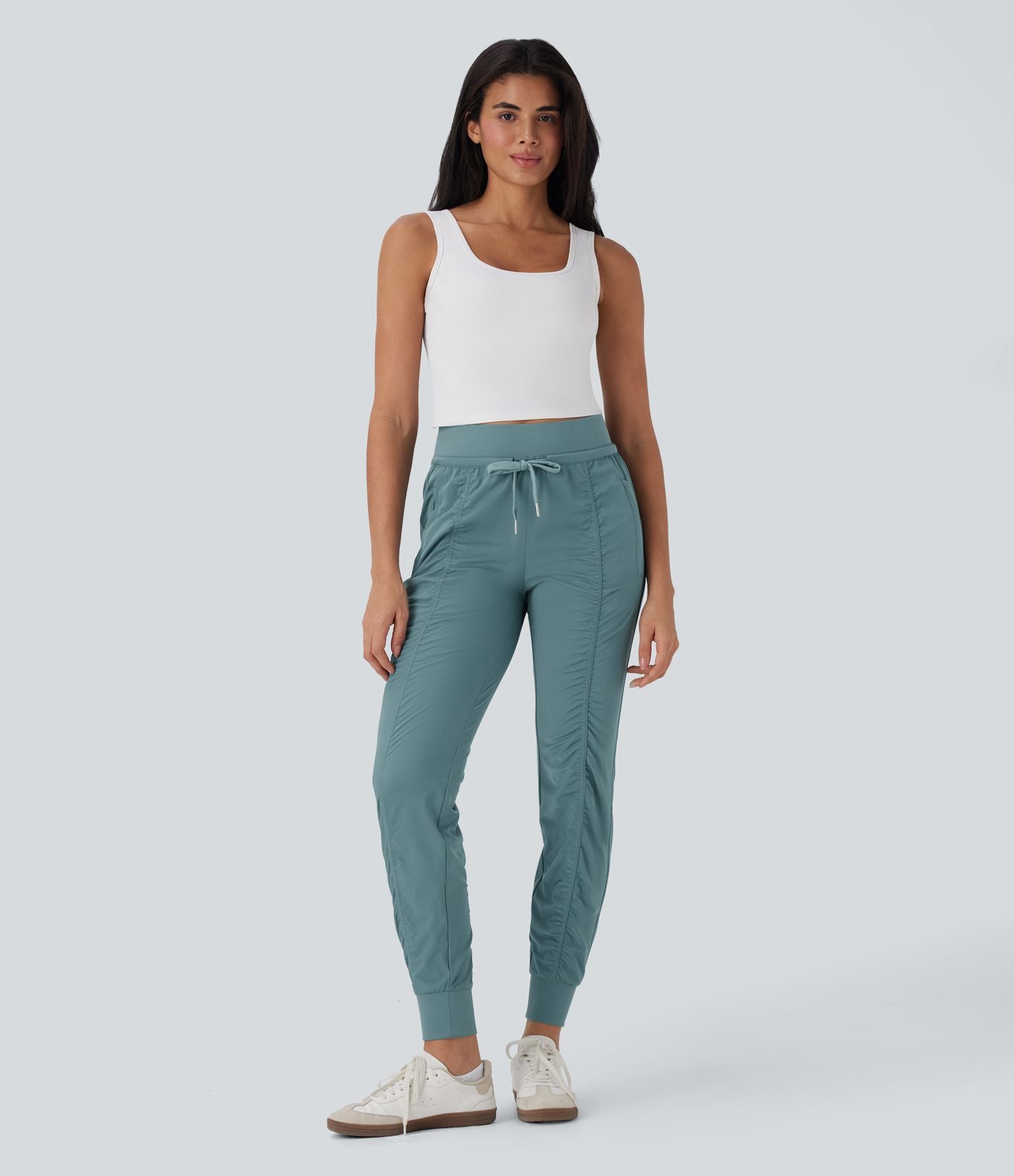 Pantalon jogging de voyage taille haute avec cordon de serrage, coupe fuselée et poches latérales zippées