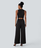 Combinaison tailleur rayée à jambes larges, décolleté en V, découpe et poches