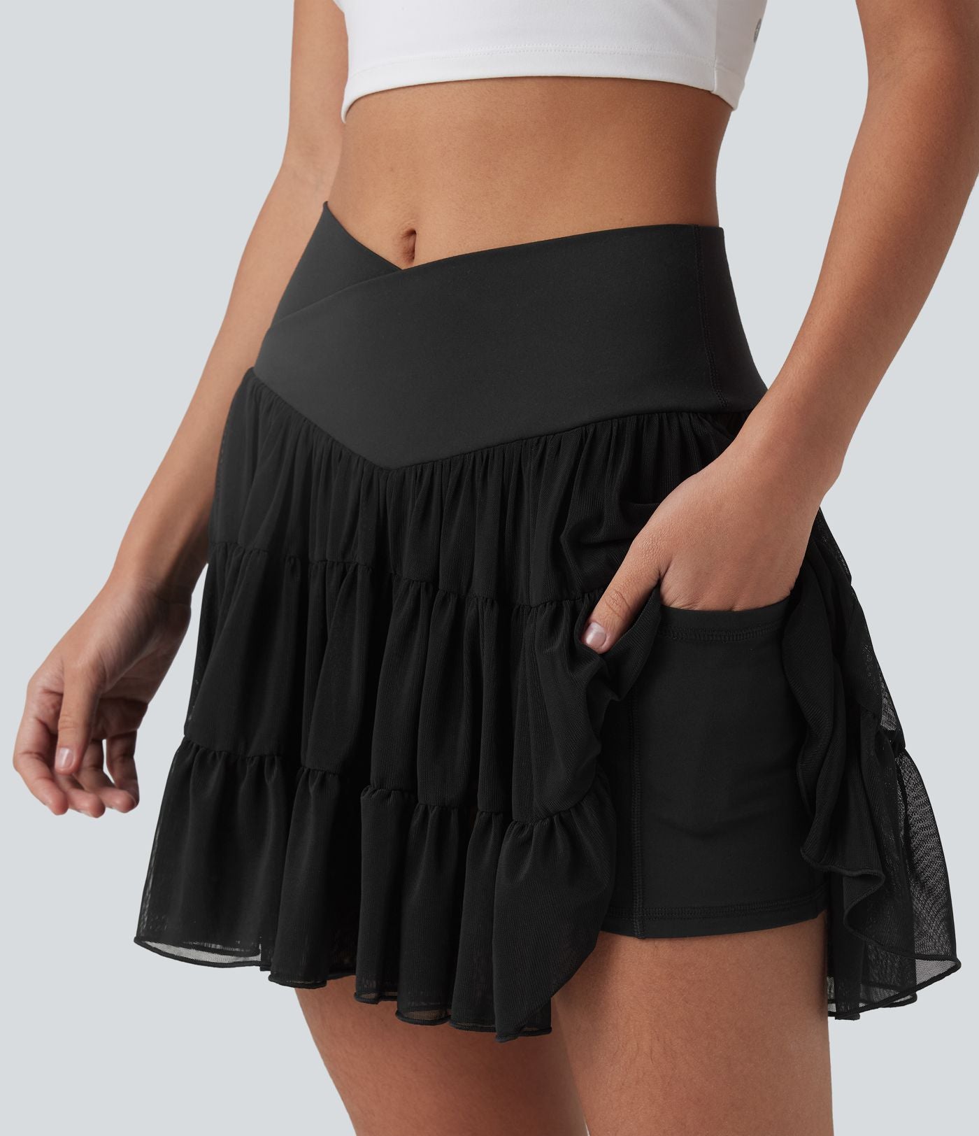 Jupe-short de tennis mini taille haute croisée fluide avec poches