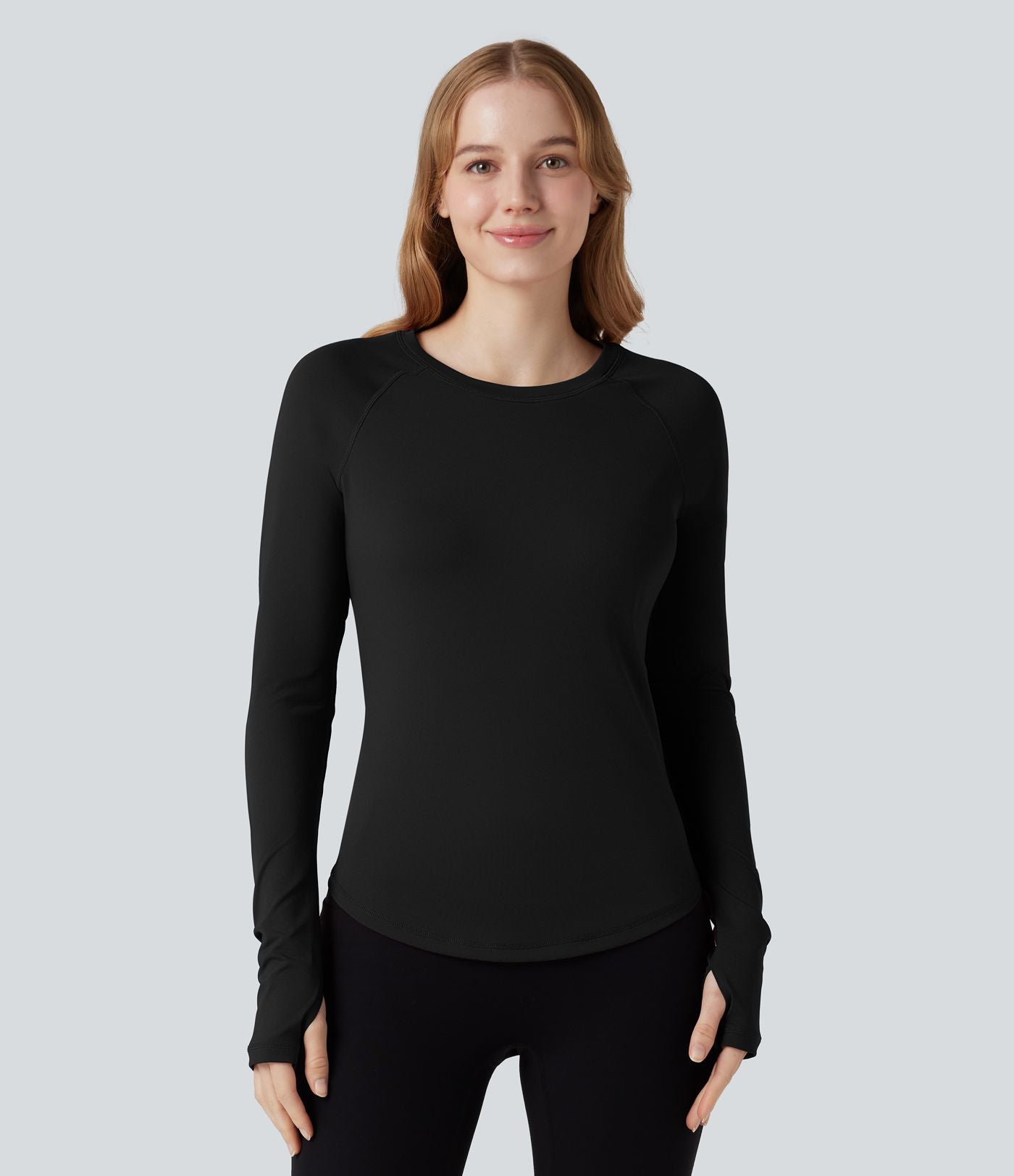 Top de sport col rond ourlet arrondi manches longues avec trous pouces et poche