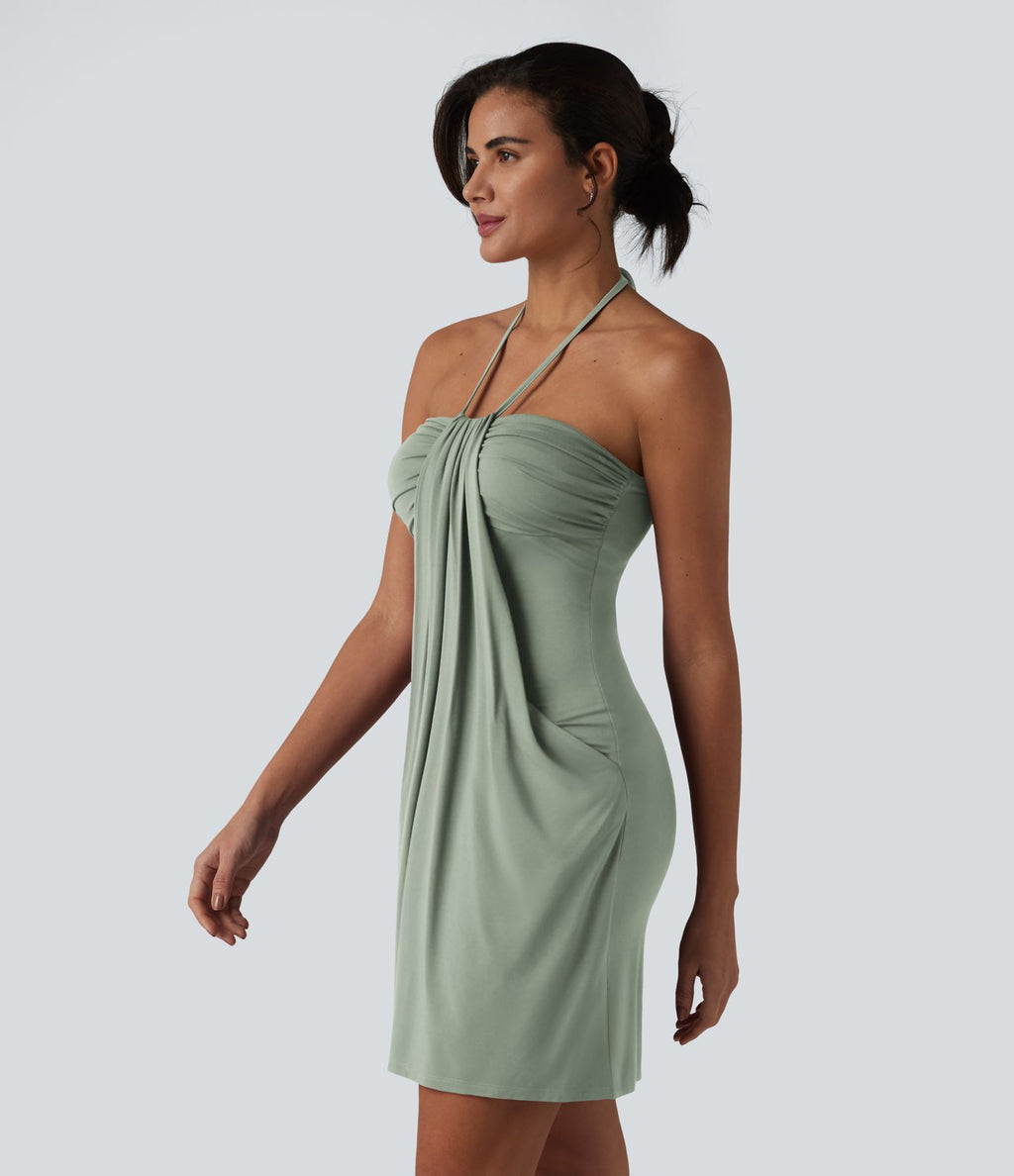 Robe resort mini dos nu à col licou avec lien noué dans le dos et poches