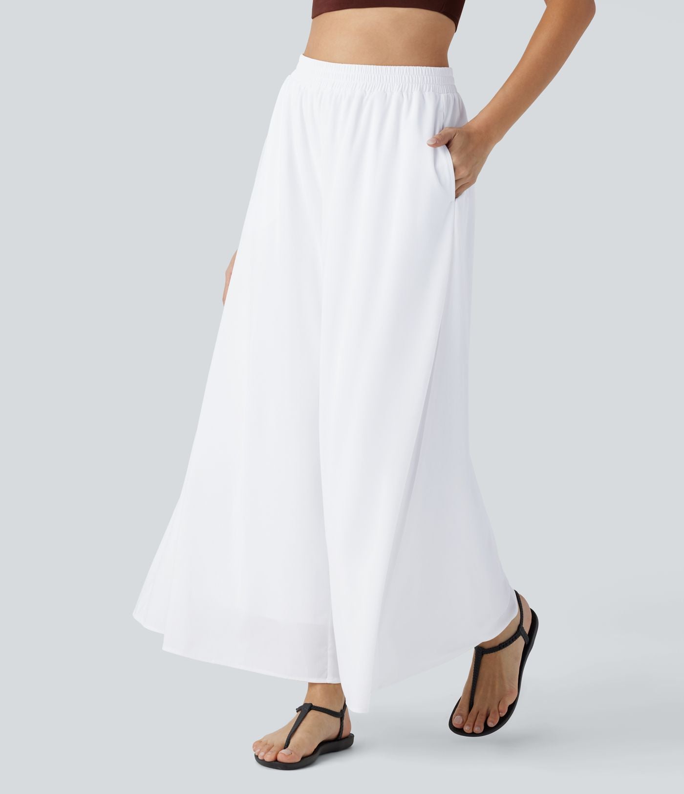 Pantalon fluide et ample avec superposition en mesh, poches latérales et taille haute