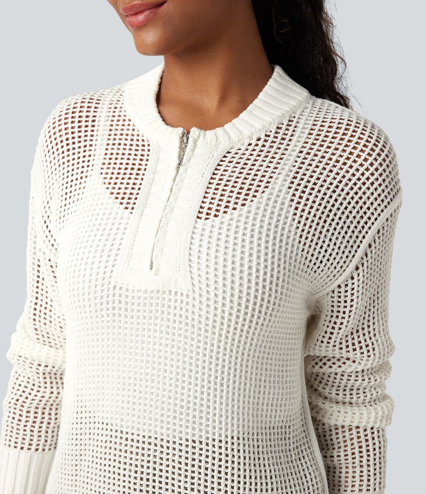 Pull ajouré demi-zip col rond manches longues