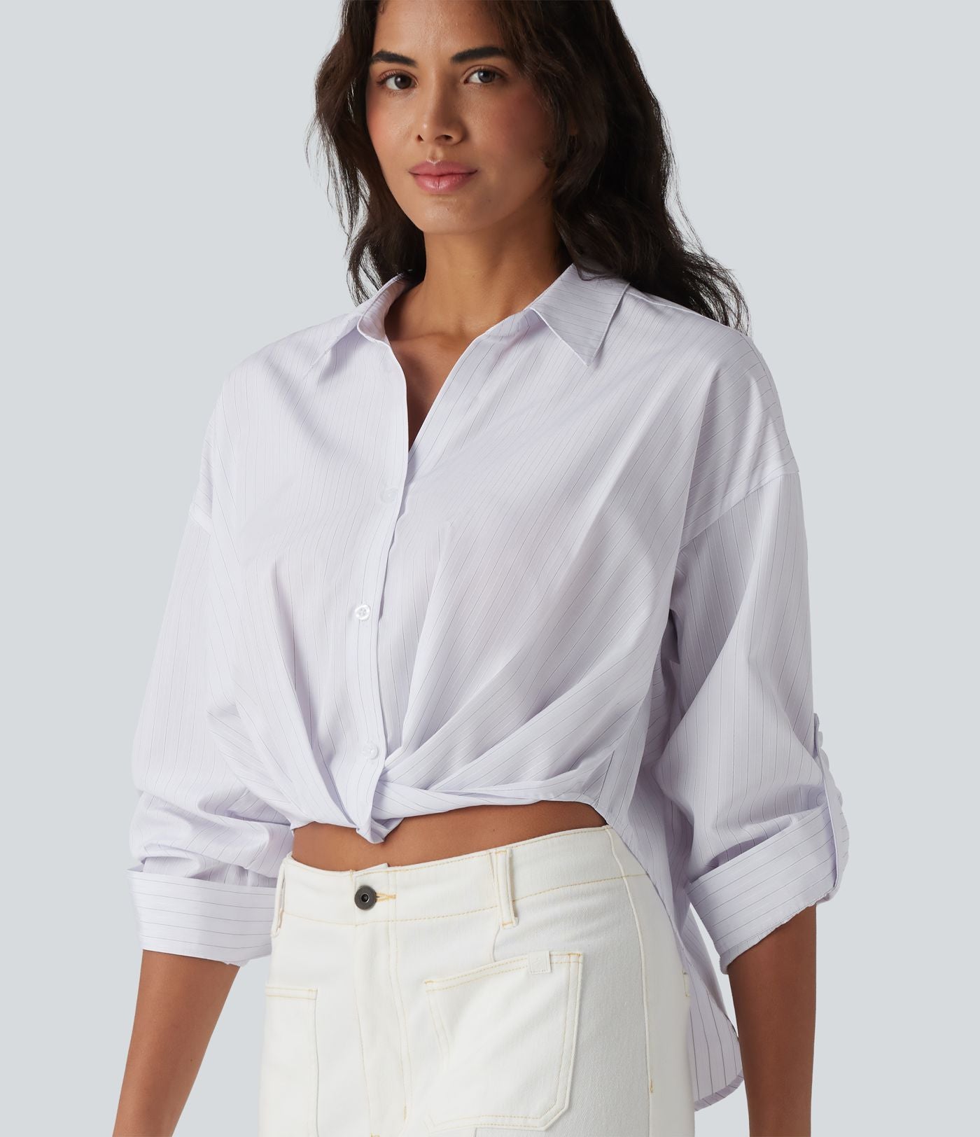 Chemise casual col manches retroussées torsadée asymétrique à rayures
