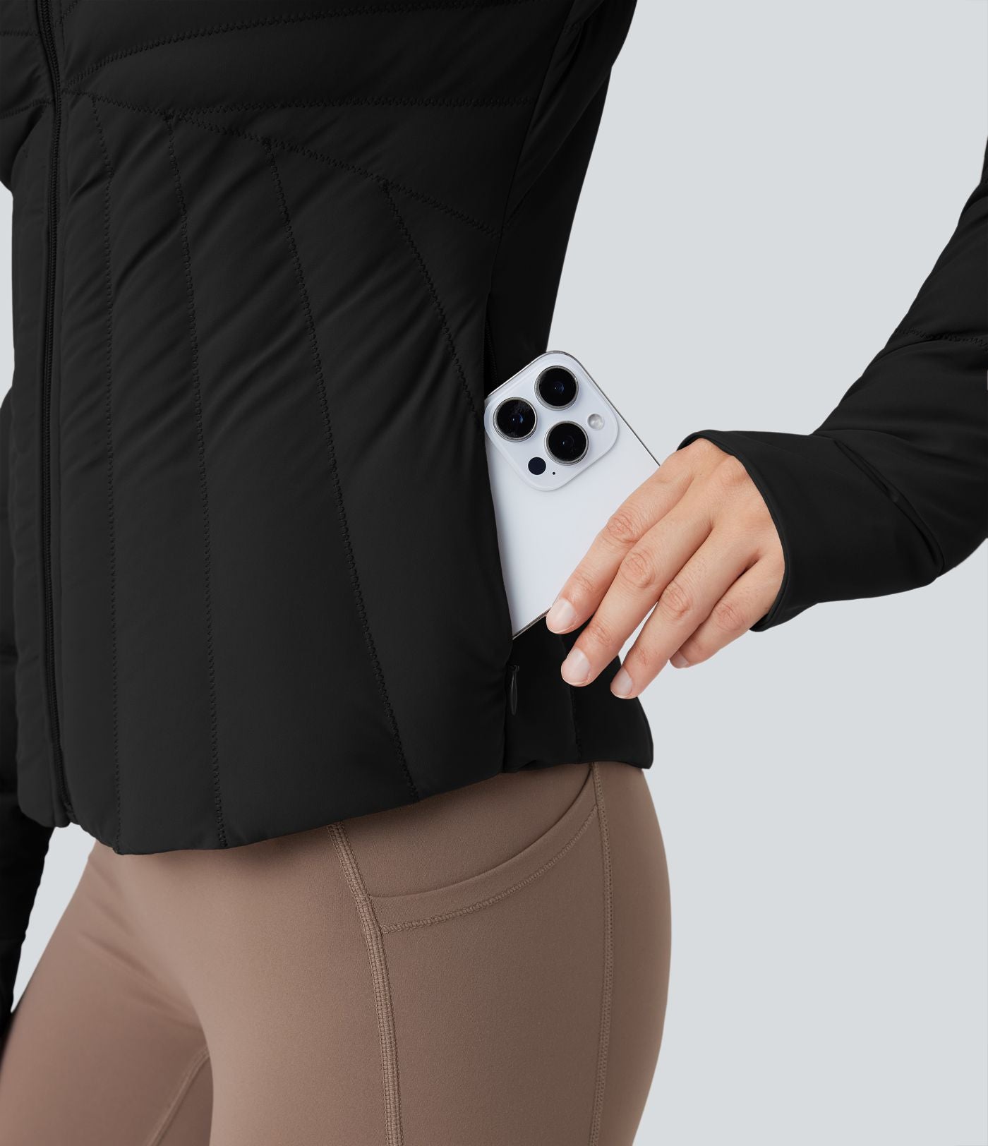 Doudoune de sport extensible col montant avec passants pouces et poches