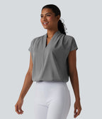 Blouse esprit bureau ample défroissage facile, col V et manches chauve-souris