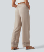 Pantalon effet lin taille haute avec cordon de serrage, bord volanté et poches