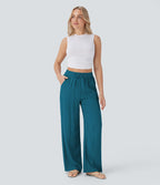 Pantalon large fluide taille haute avec cordon de serrage, poches latérales et aspect lin