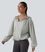 Veste de course légère à capuche manches longues avec poches, cordon de serrage et protection UPF 50+