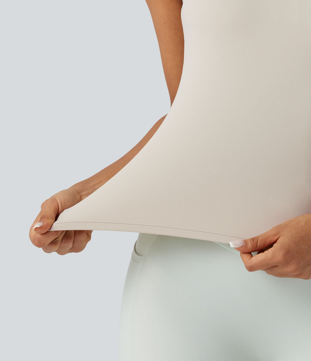 Débardeur de sport effet lissant sous les bras avec dos en V et brassière intégrée
