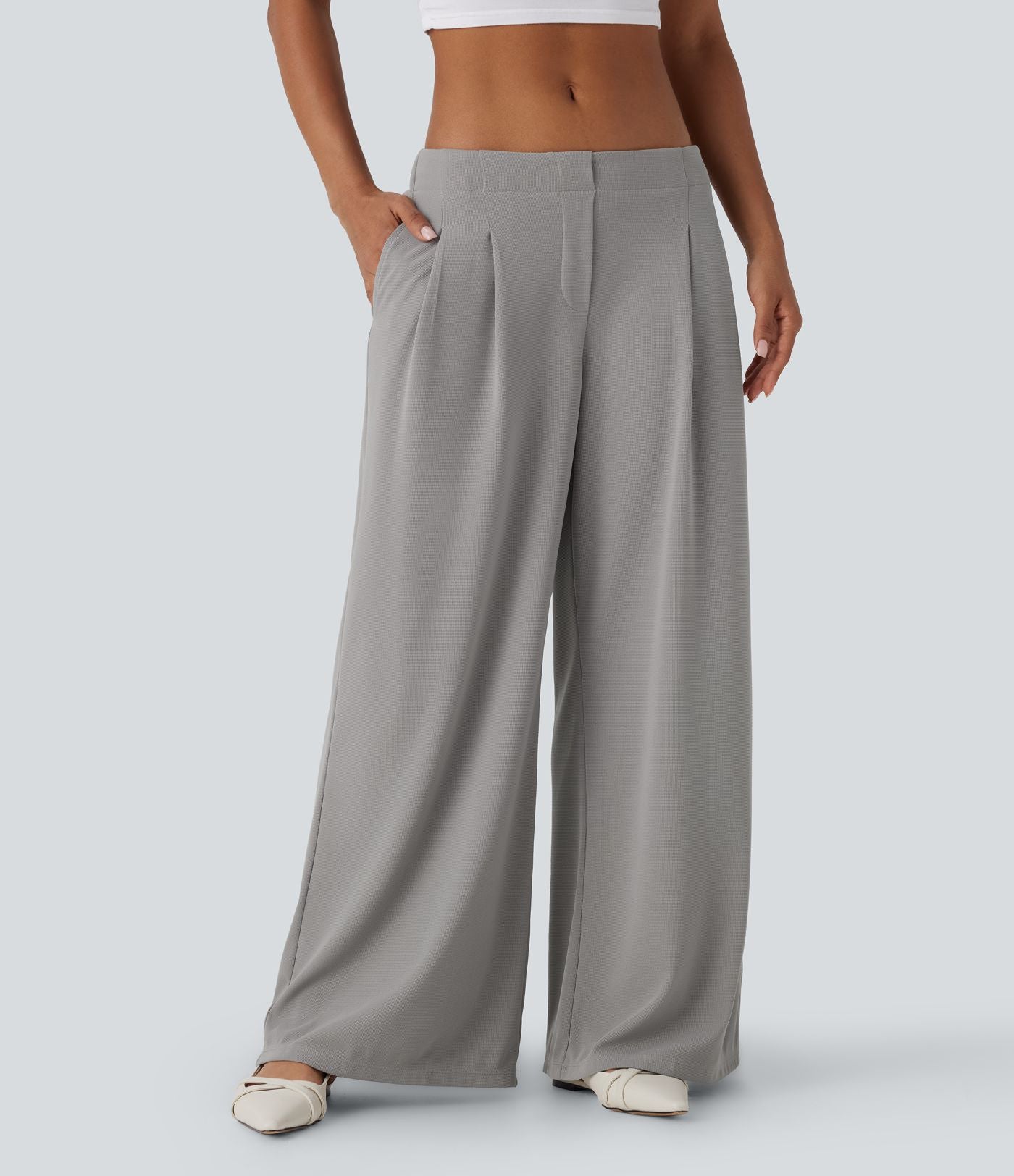 Pantalon décontracté taille basse à jambes larges en tissu gaufré avec poches latérales