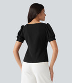 Blouse habillée col carré à manches bouffantes et tissu texturé