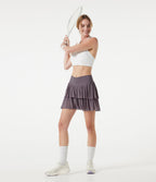 Jupe-short tennis mini fluide taille haute croisée en mesh à volants, avec poches
