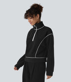 Sweat bicolore en polaire col montant avec demi-zip et manches longues