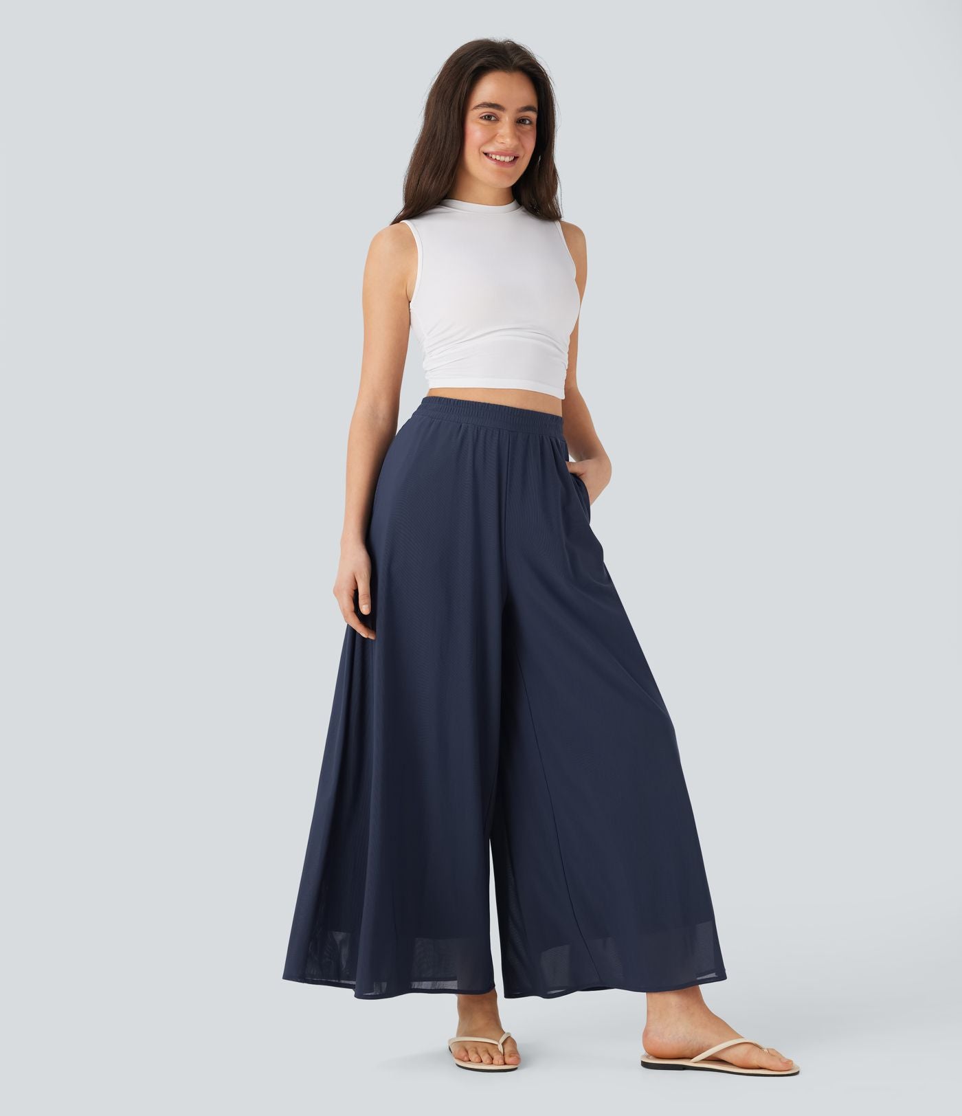 Pantalon fluide et ample avec superposition en mesh, poches latérales et taille haute