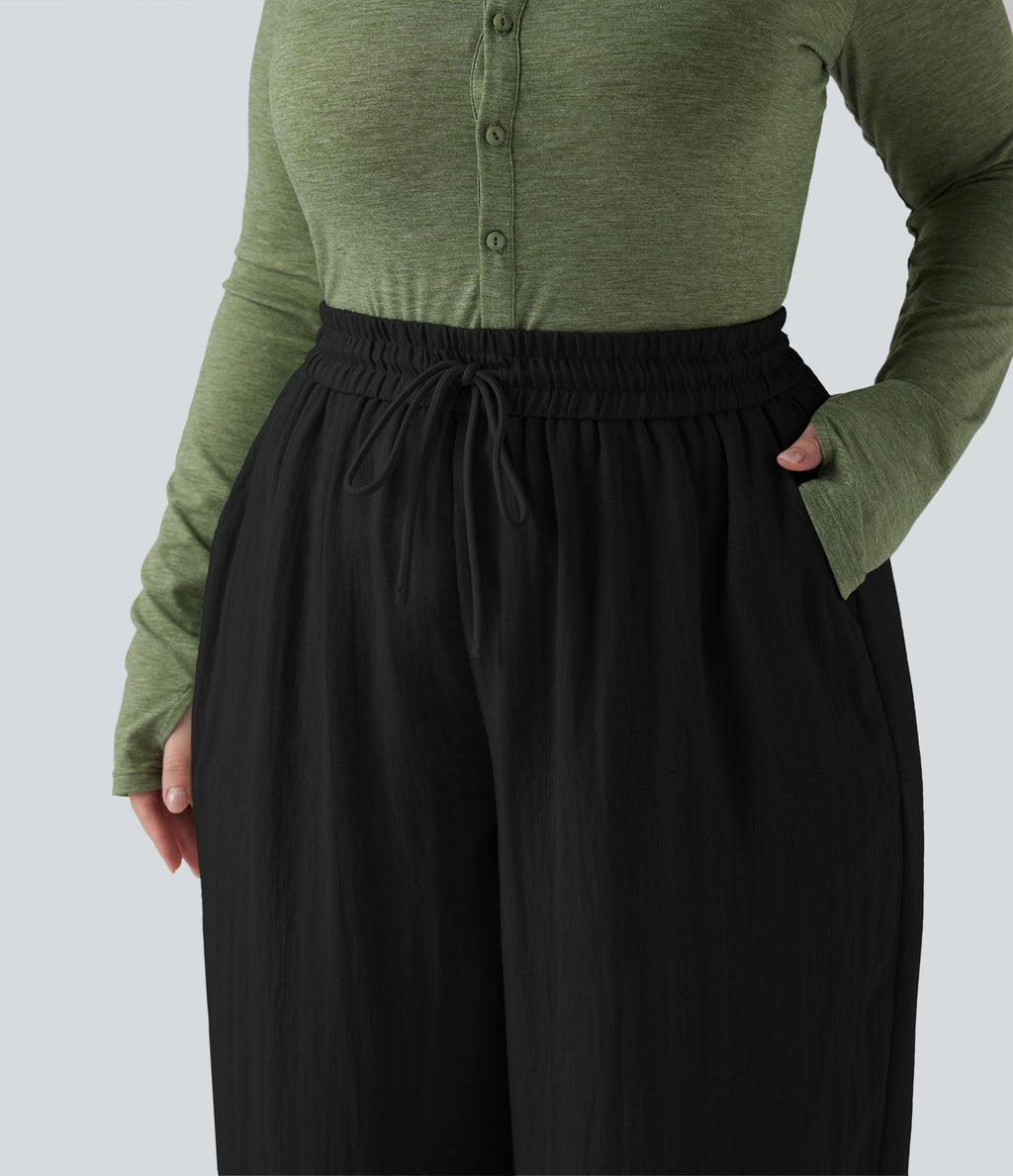 Pantalon grande taille large fluide taille haute avec cordon de serrage, poches et aspect lin