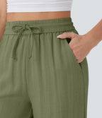 Pantalon large fluide taille haute avec cordon de serrage, poches latérales et aspect lin
