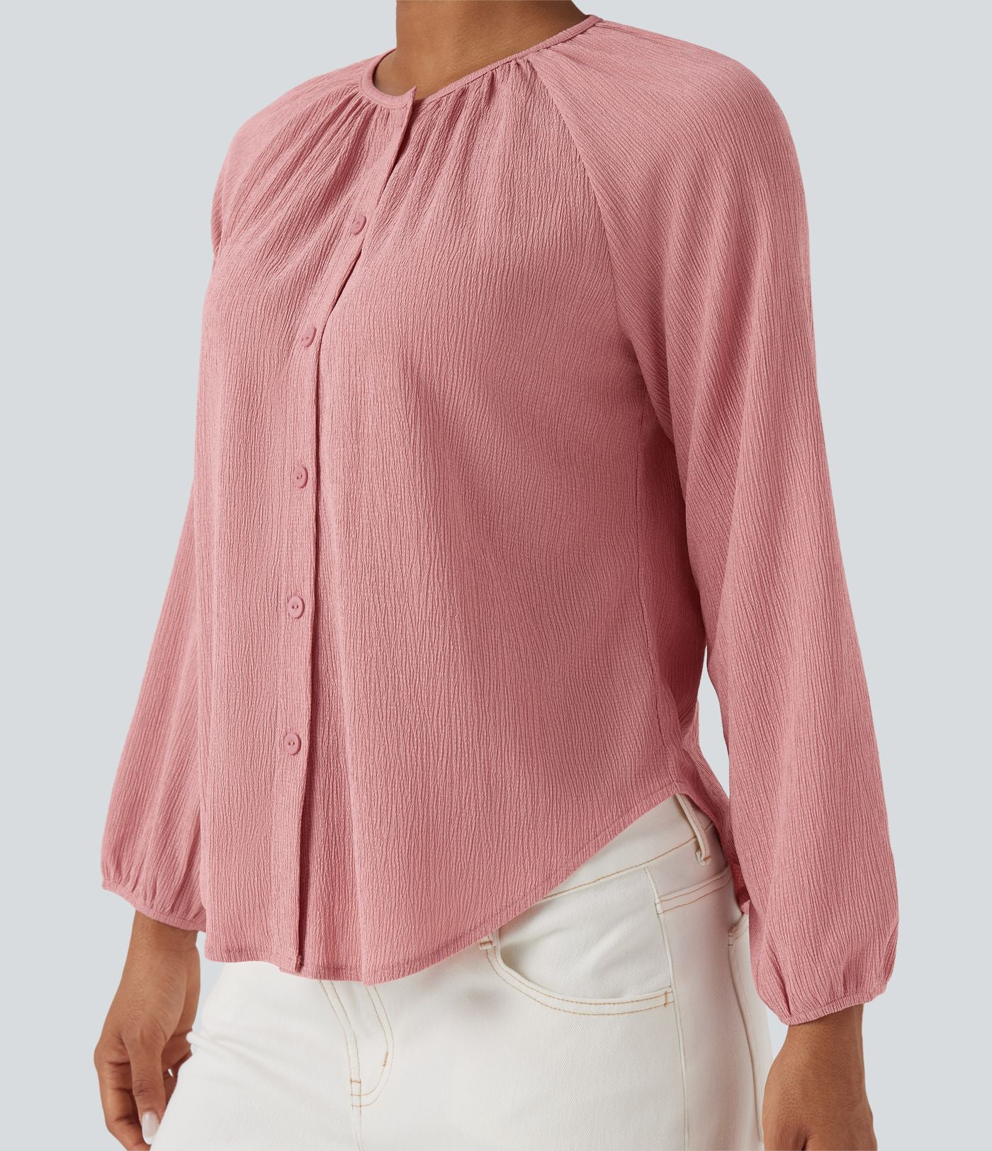 Blouse texturée col rond manches longues ourlet arrondi