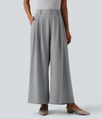Pantalon tailleur 7/8 large plissé taille haute aspect lin avec poches