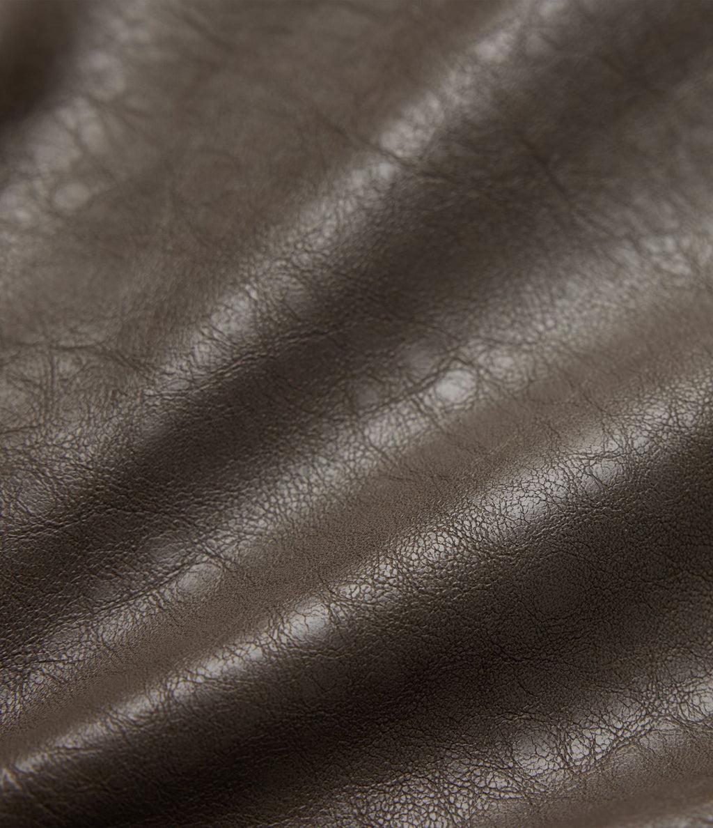 Veste décontractée en tissu enduit à fermeture éclair et manches longues avec poches