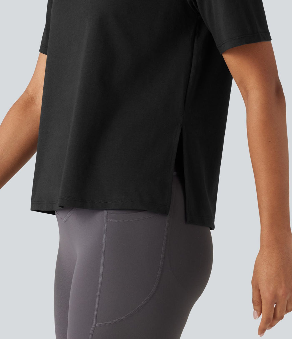 Haut de sport en coton col rond à manches courtes, ourlet fendu et coupe ample pour le yoga