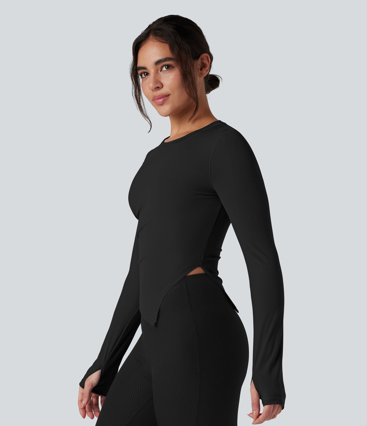 Top de sport yoga col rond ourlet asymétrique fendu manches longues avec trous pouces