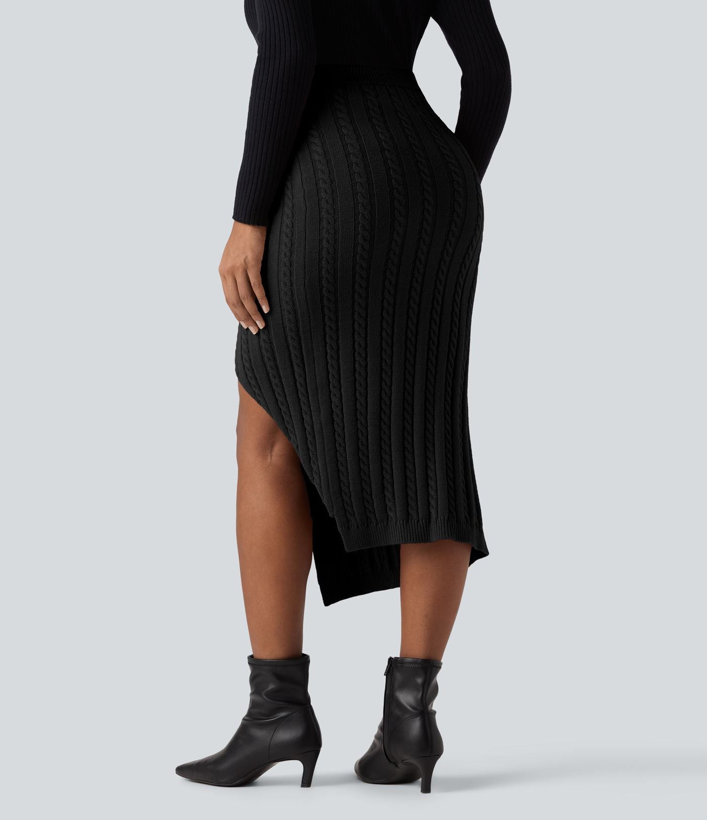 Jupe pull moulante mi-longue taille haute en maille torsadée avec fente