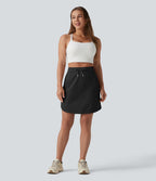 Jupe-short golf mini 2-en-1 taille haute à cordon de serrage et ourlet arrondi avec poches - Longueur plus longue