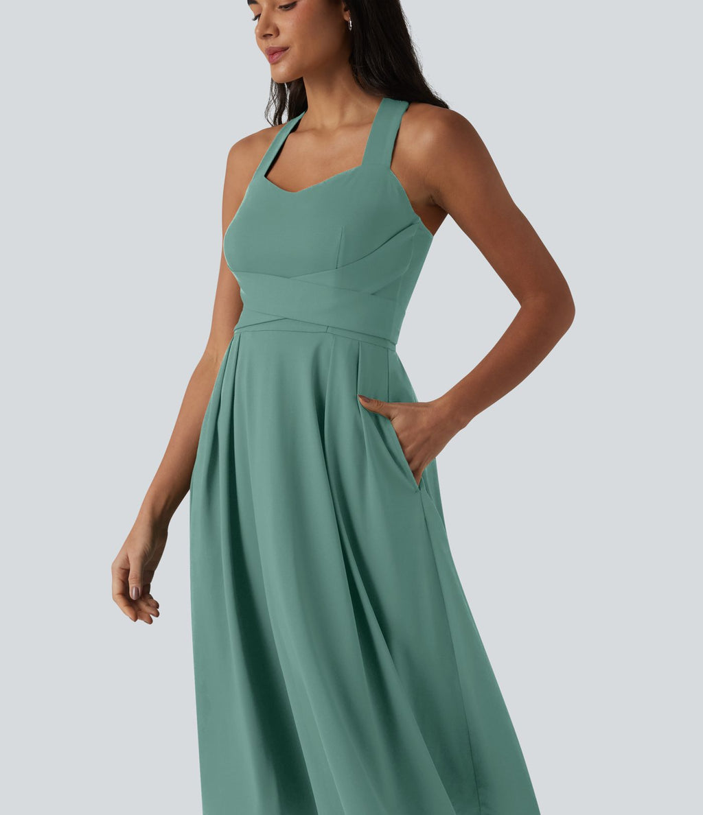Robe midi fluide sans manches décolleté cœur avec bretelles croisées, nœud dans le dos et poches
