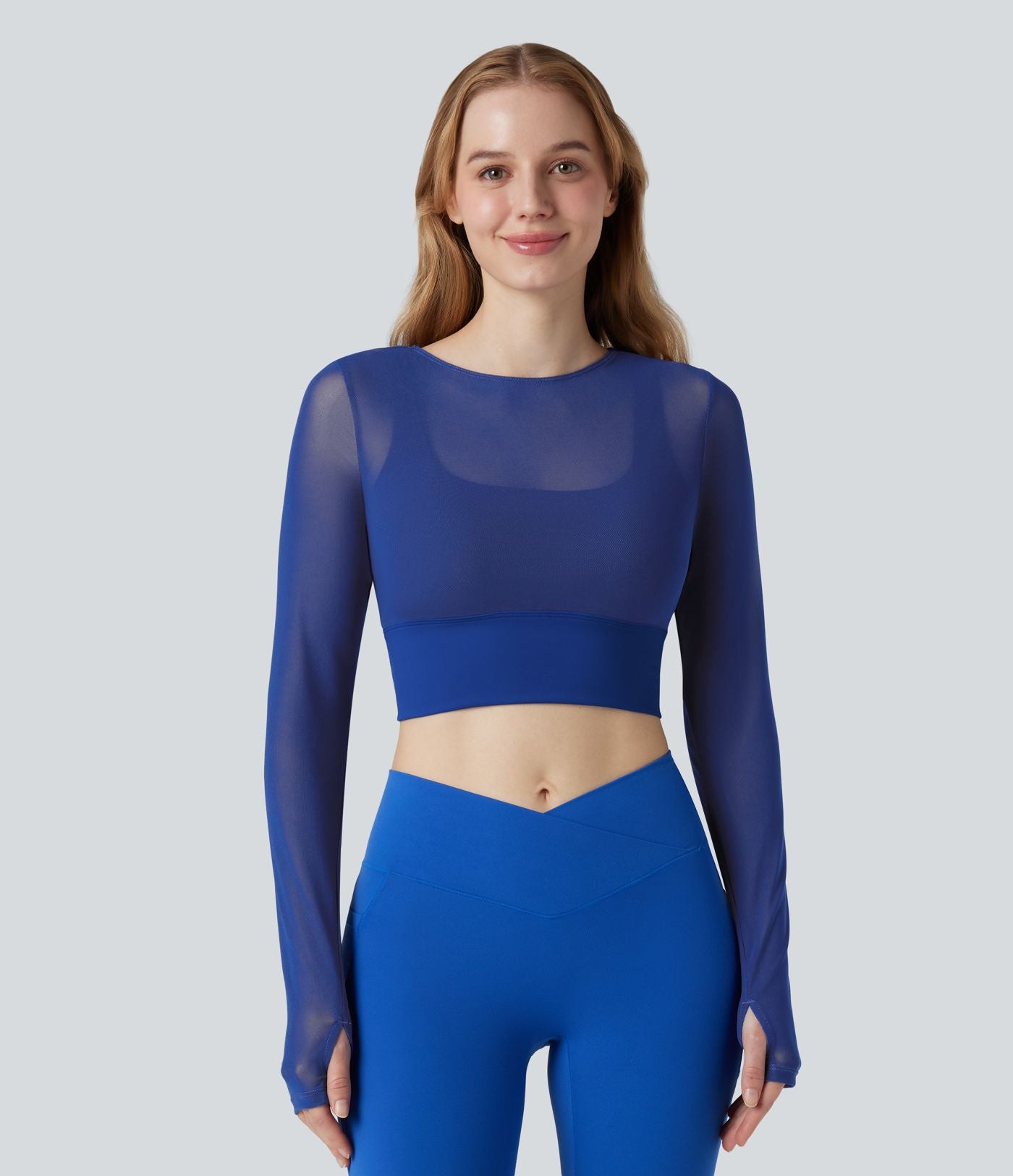 Haut de sport yoga cropped 2-en-1 manches longues mesh contrastant à trous pouces