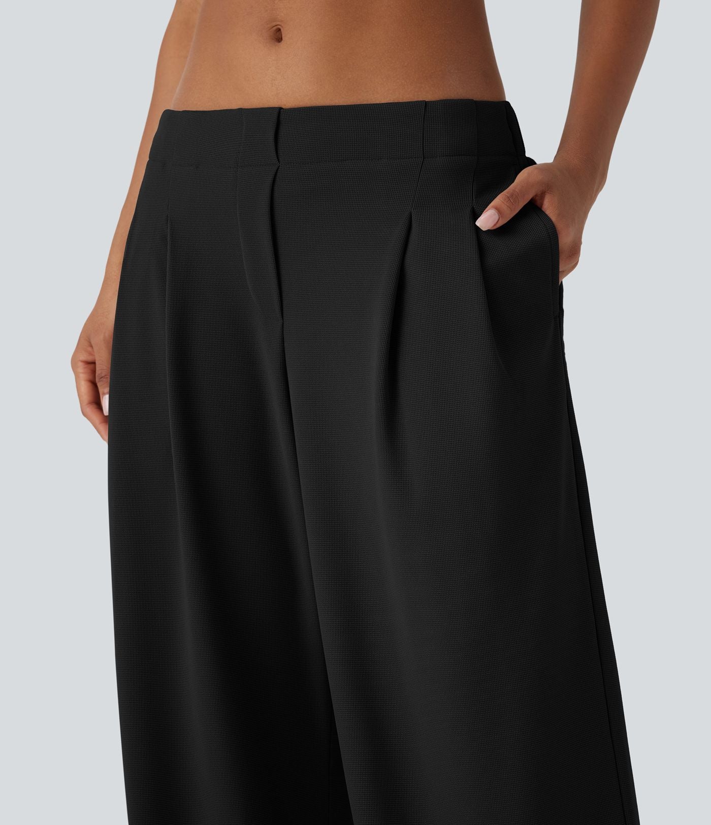 Pantalon décontracté taille basse à jambes larges en tissu gaufré avec poches latérales
